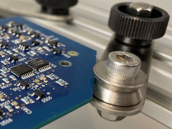 Circuit boards can be held by the edges using the Edge Clamp v-grove.