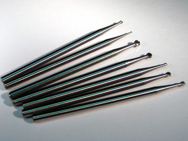 A package of 8 different-sized carbide-tipped ball mills for drilling out damaged plated-through holes.